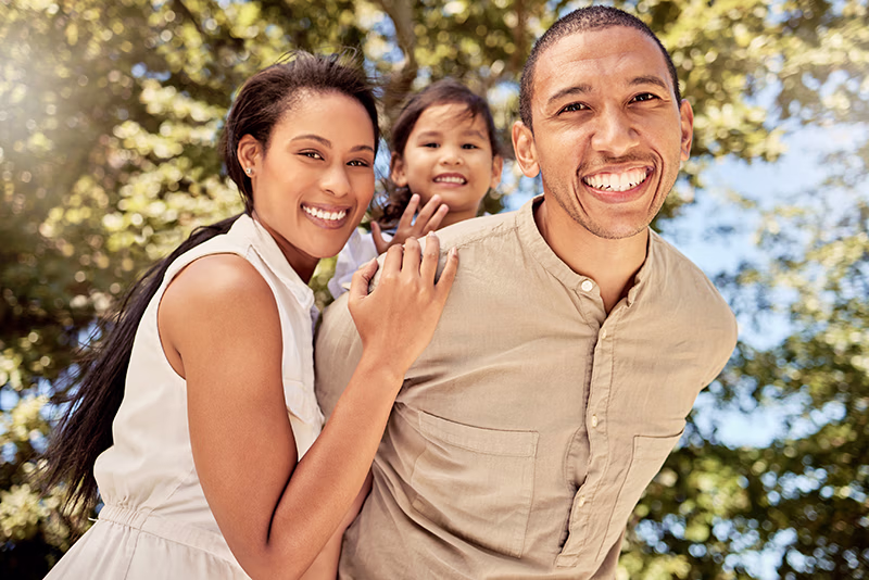 family-couple-child-being-happy-smile-relax-fun-vacation-joy-together-outdoor-portrait-man-woman-with-kid-have-quality-time-bonding-embrace-being-playful-cheerful